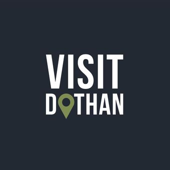 A logo that says visit dothan on a dark background