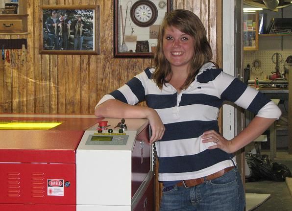 woman posing next to their rabbit laser usa machine 