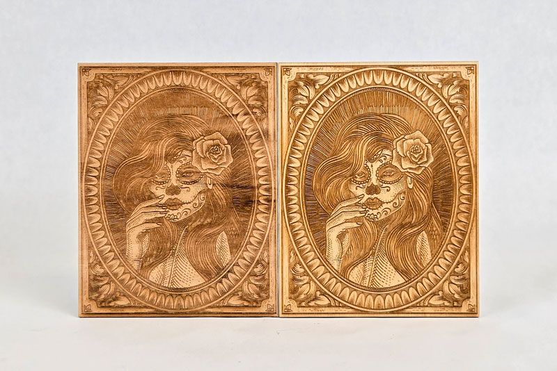 Two engraved wood panels with the same portrait design side by side, showing variation in engraving results.