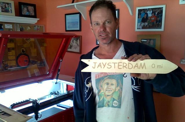 man posing with a finished laser engraved and cut project from their rabbit laser usa machine