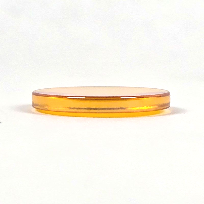 Side view of CO2 laser lens highlighting thickness difference between curved and flat surfaces
