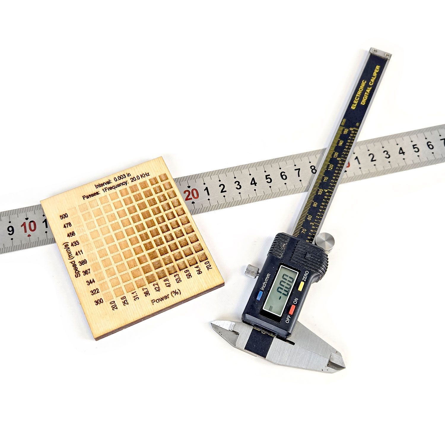 calipers, material test card, and metal metric ruler