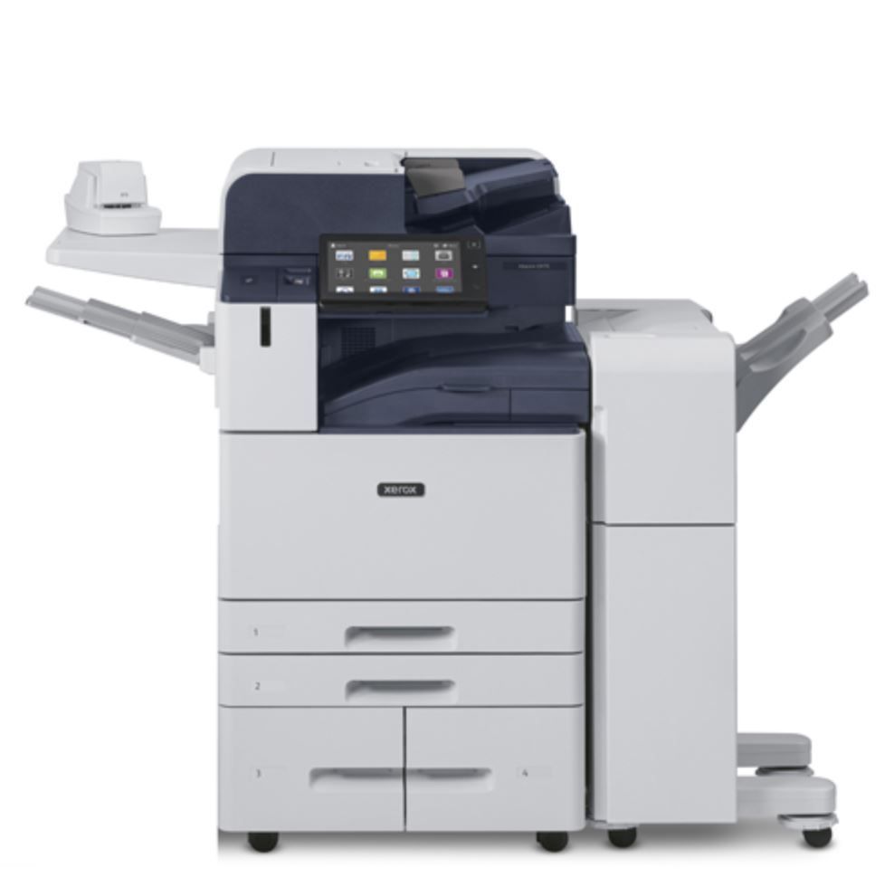 Una stampante fotocopiatrice è appoggiata sopra un mobiletto bianco.