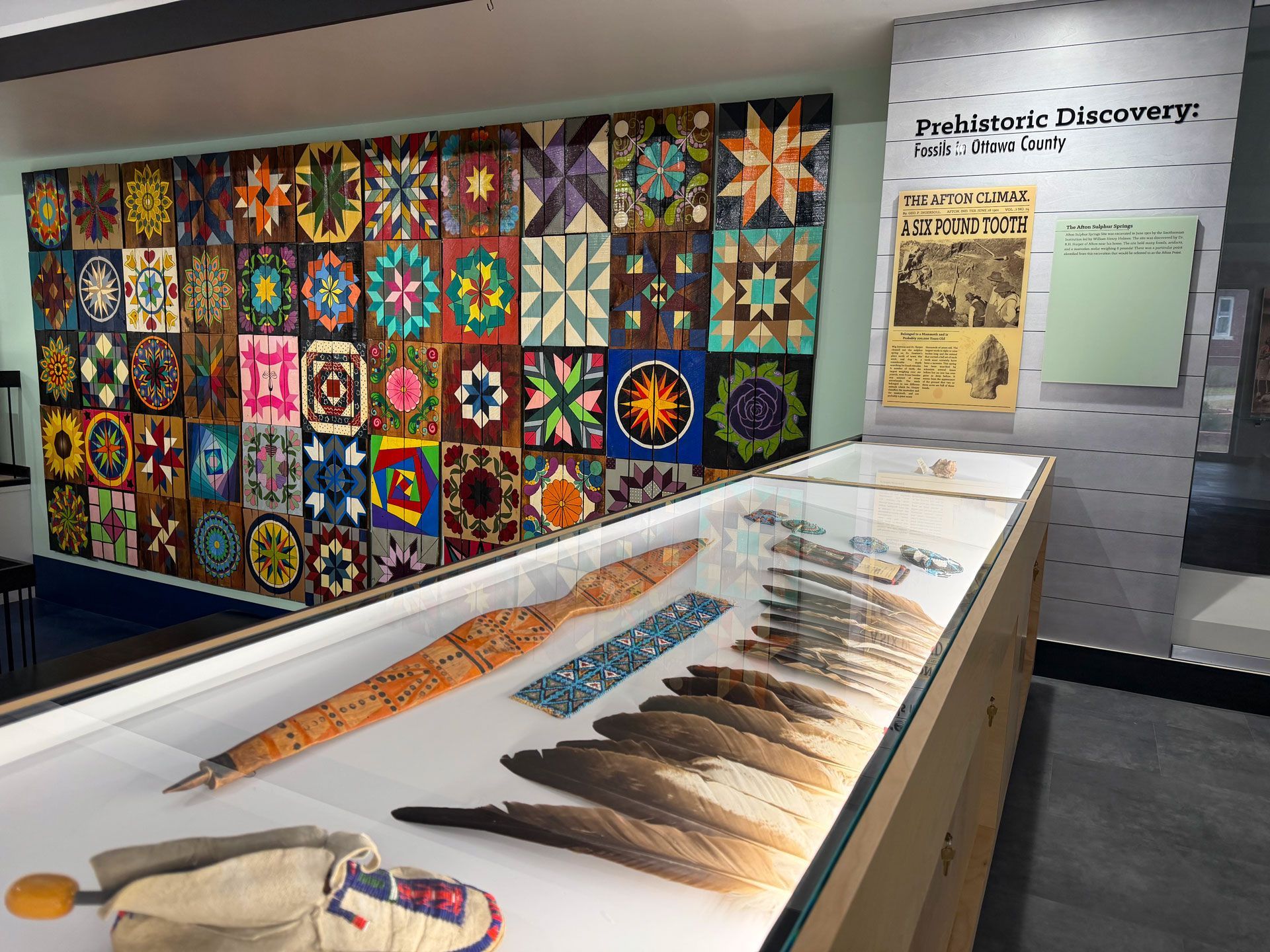 Large, colorful barn quilt displayed at the Dobson Museum, one of the largest in Ottawa County, welcomes visitors.