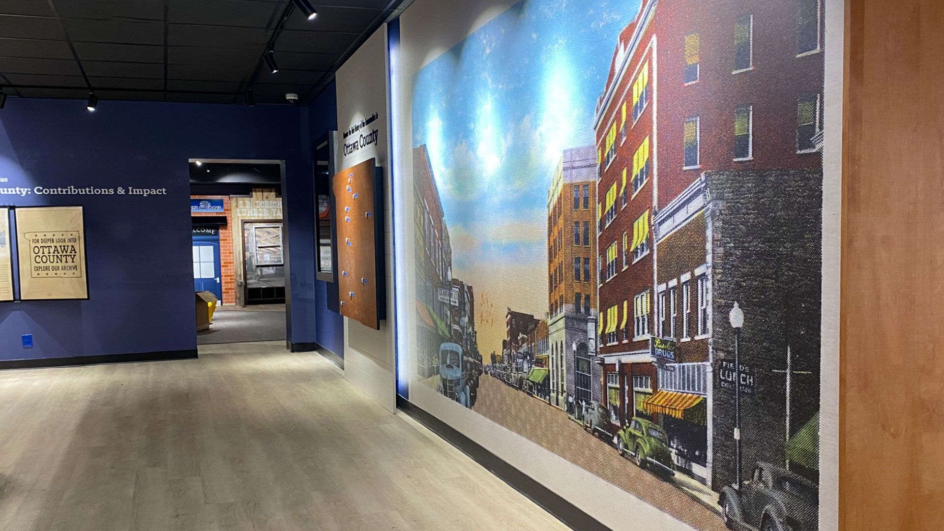 Communities That Shaped the County gallery at the Dobson Museum, highlighting local schools, churche