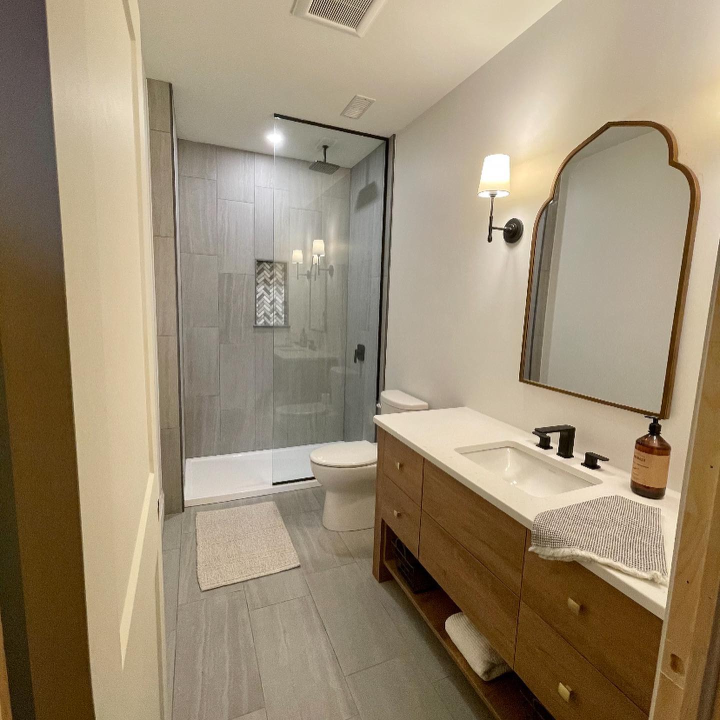 completed plumbing project residential bathroom sink and shower