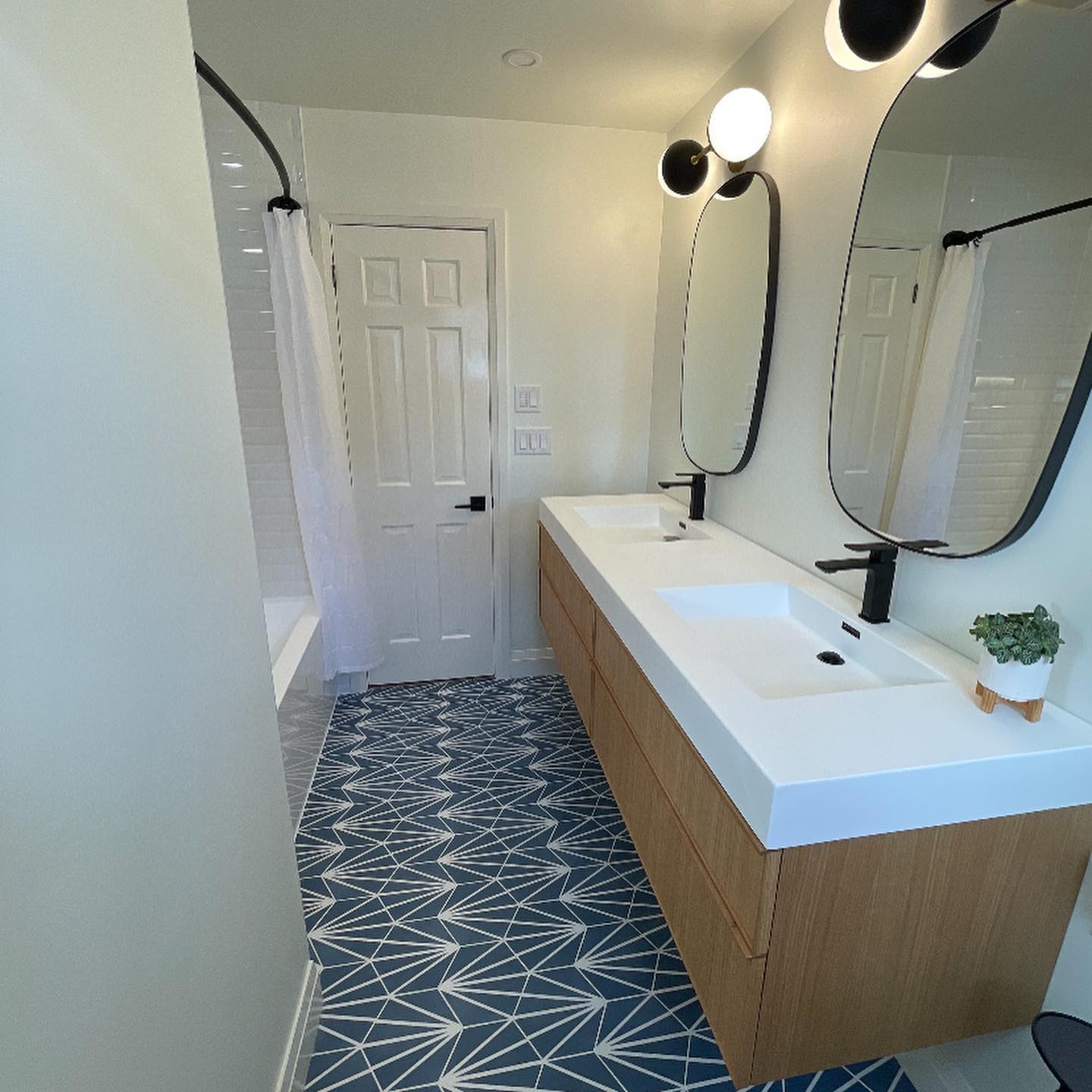 completed plumbing project residential bathroom sink and shower