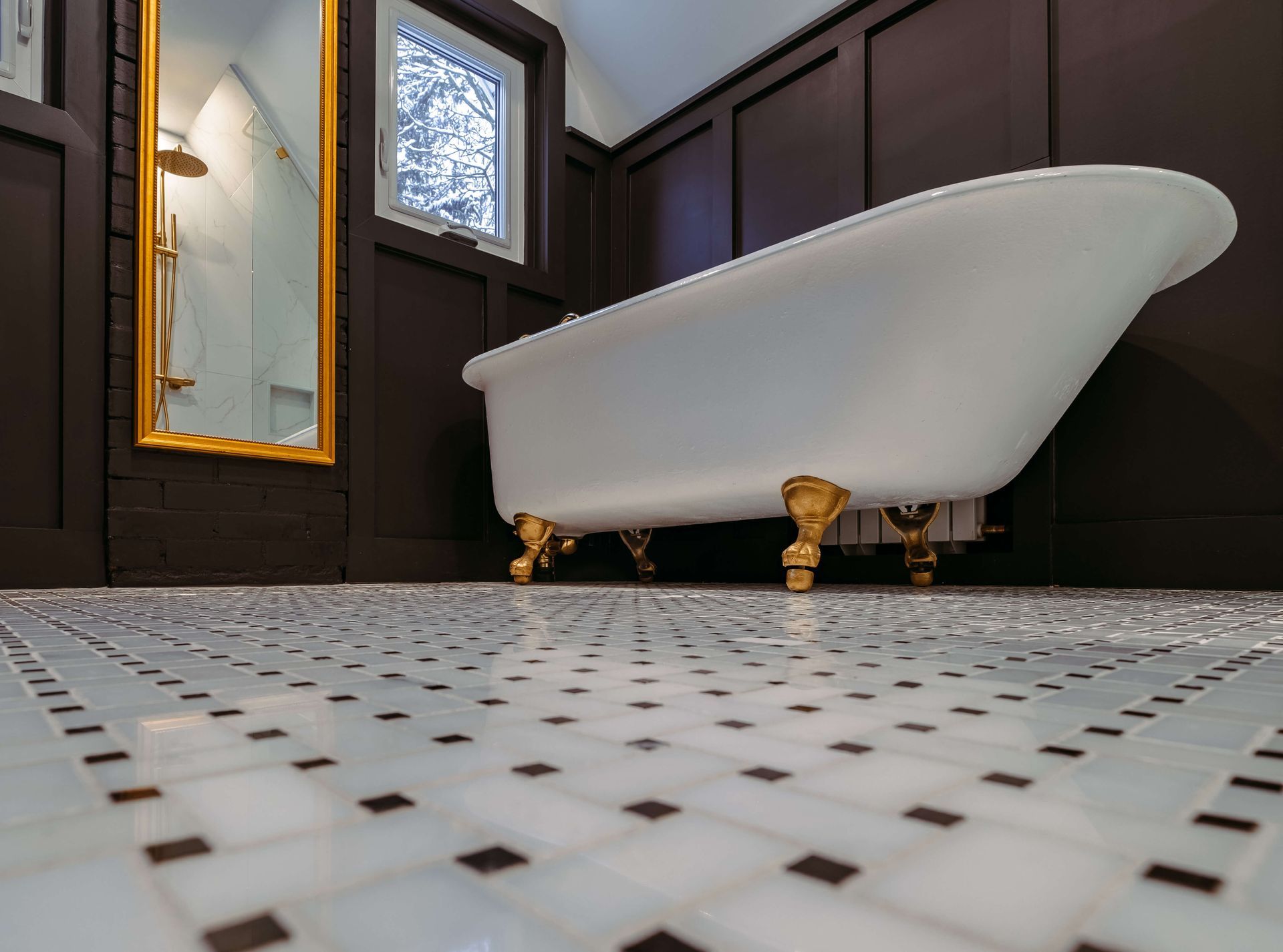 plumbing project of residential bathroom tiled flooring with freestanding bathtub