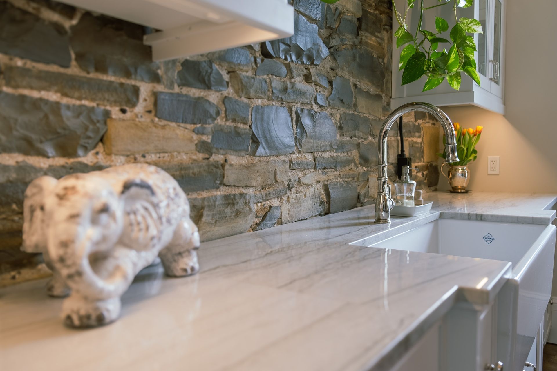 A kitchen counter with a sink in the background.