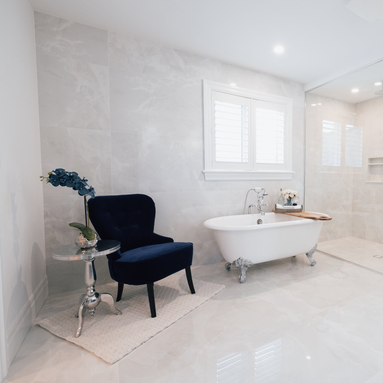 white bathroom with a freestanding bathtub