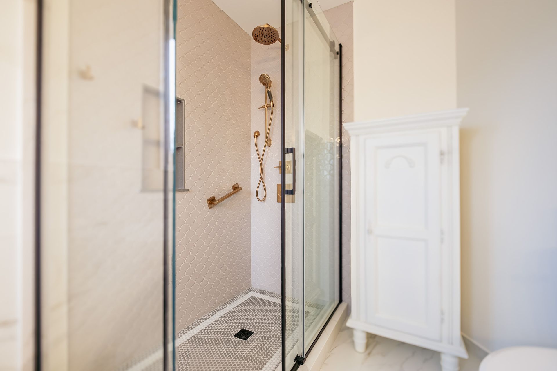 A bathroom with a walk in shower and a toilet.