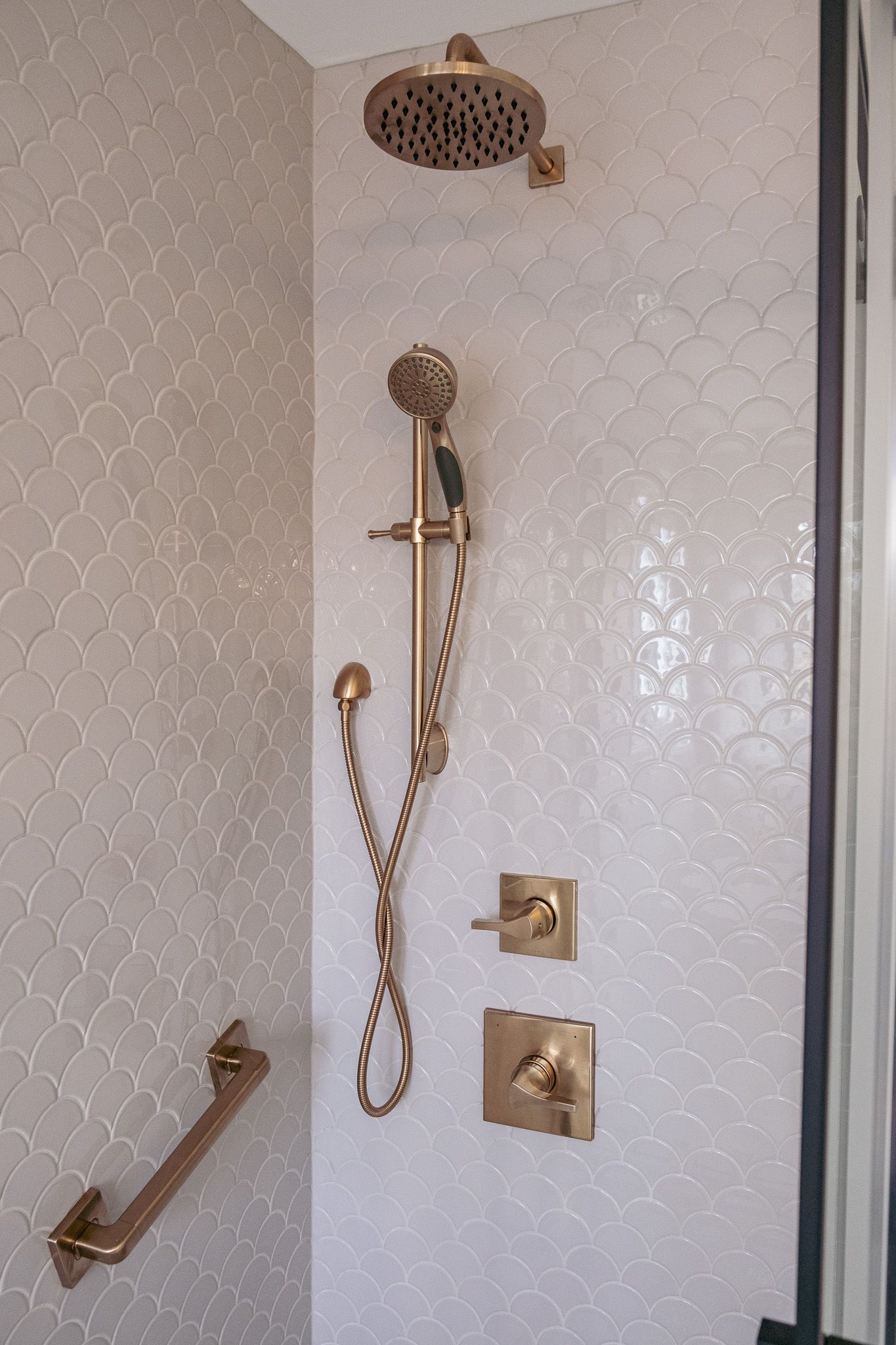 A shower with a large shower head.