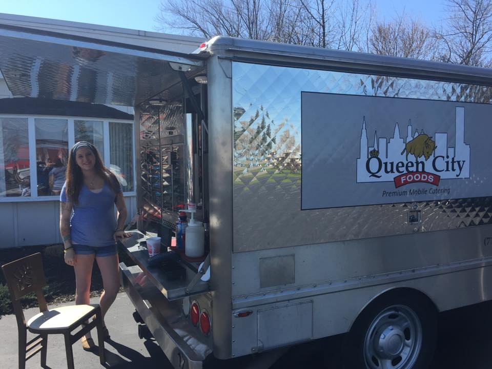 Food Truck Services — Woman Beside Food Truck On Sunny Day  in Buffalo, NY