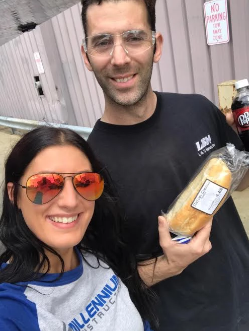 Mobile Catering — Smiling Woman and Man Holding A Bread in Buffalo, NY