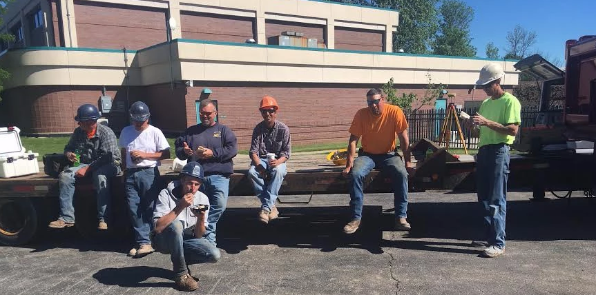 Lunch Catering — Group Of Man Eating On Sunny Day in Buffalo, NY