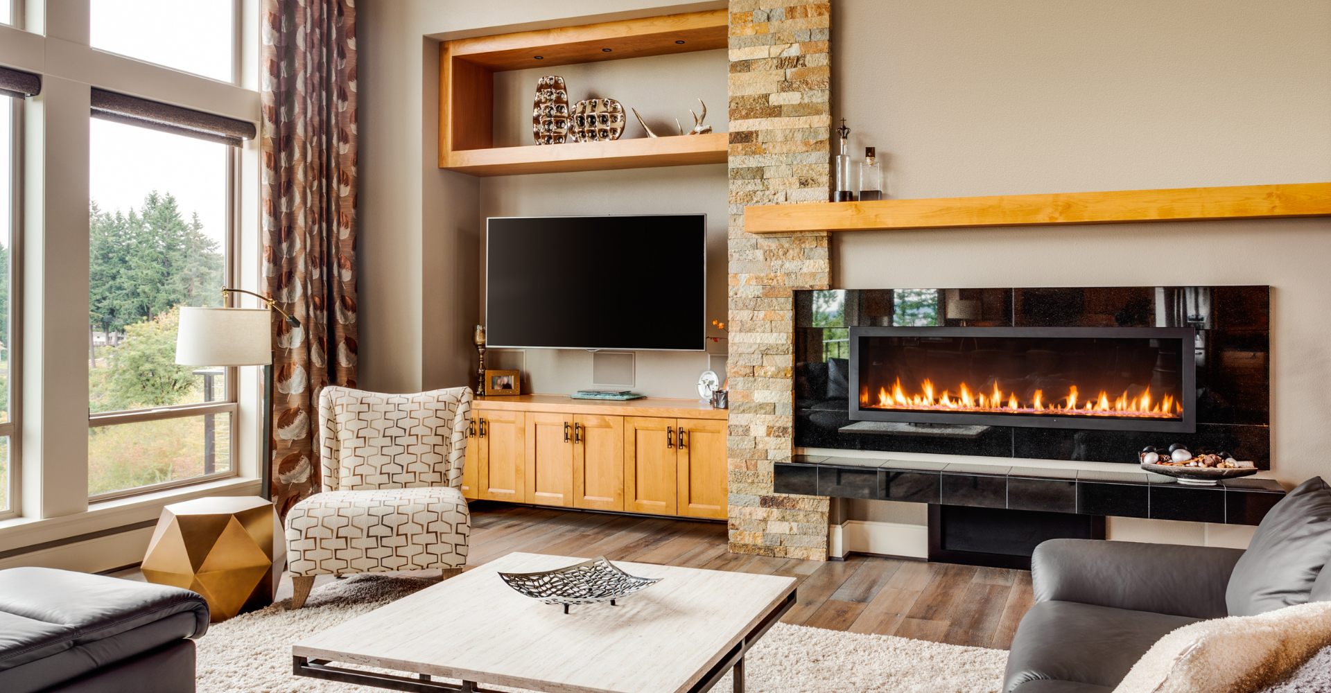 A living room with a fireplace and a flat screen tv.