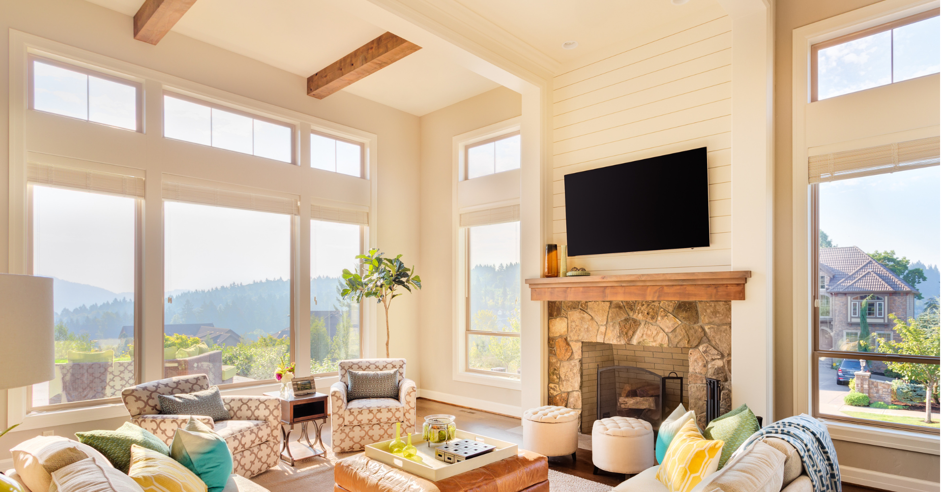 A living room with a fireplace and a flat screen tv.