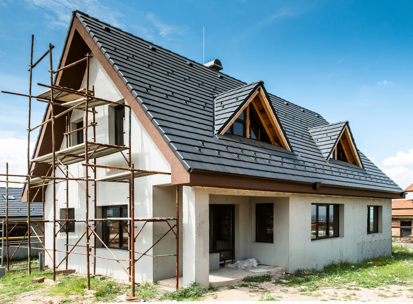 A house is being built with scaffolding around it.