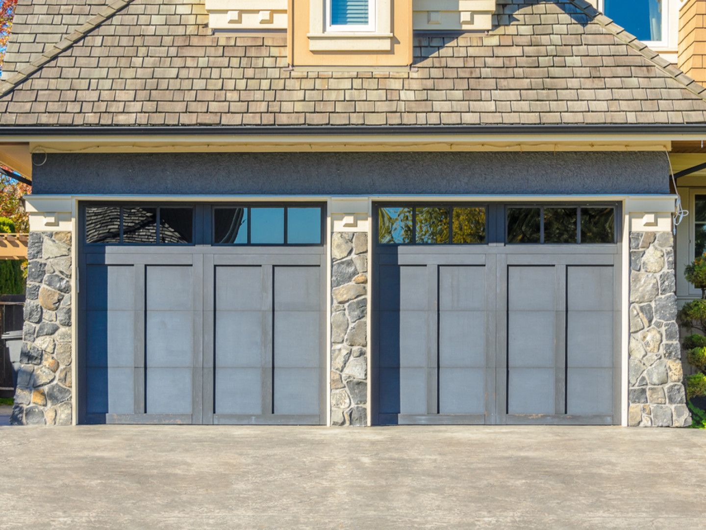 Vintage Rustic Garage with a modern flare by Compass Construction