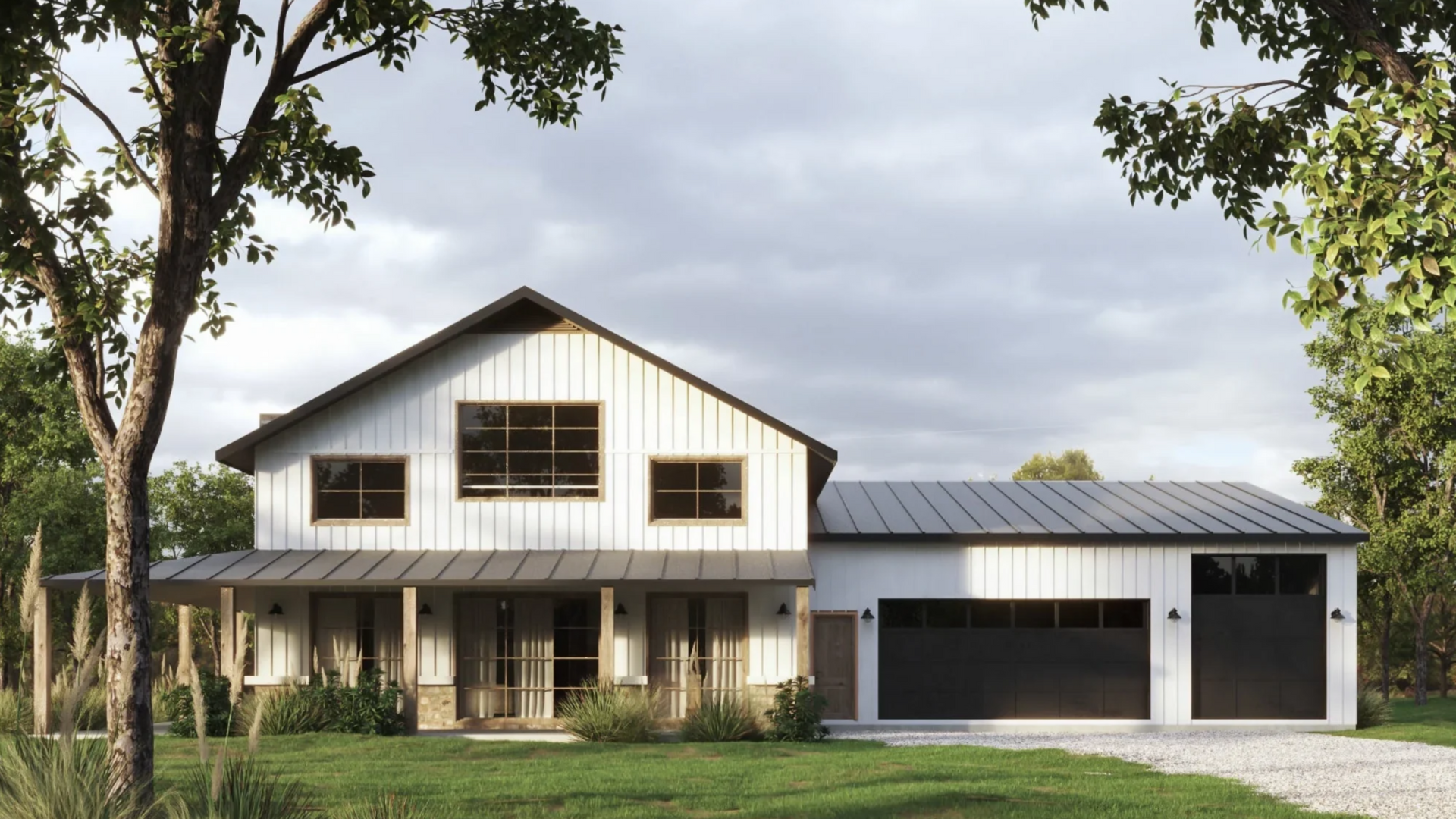 A white house with black garage doors and a porch