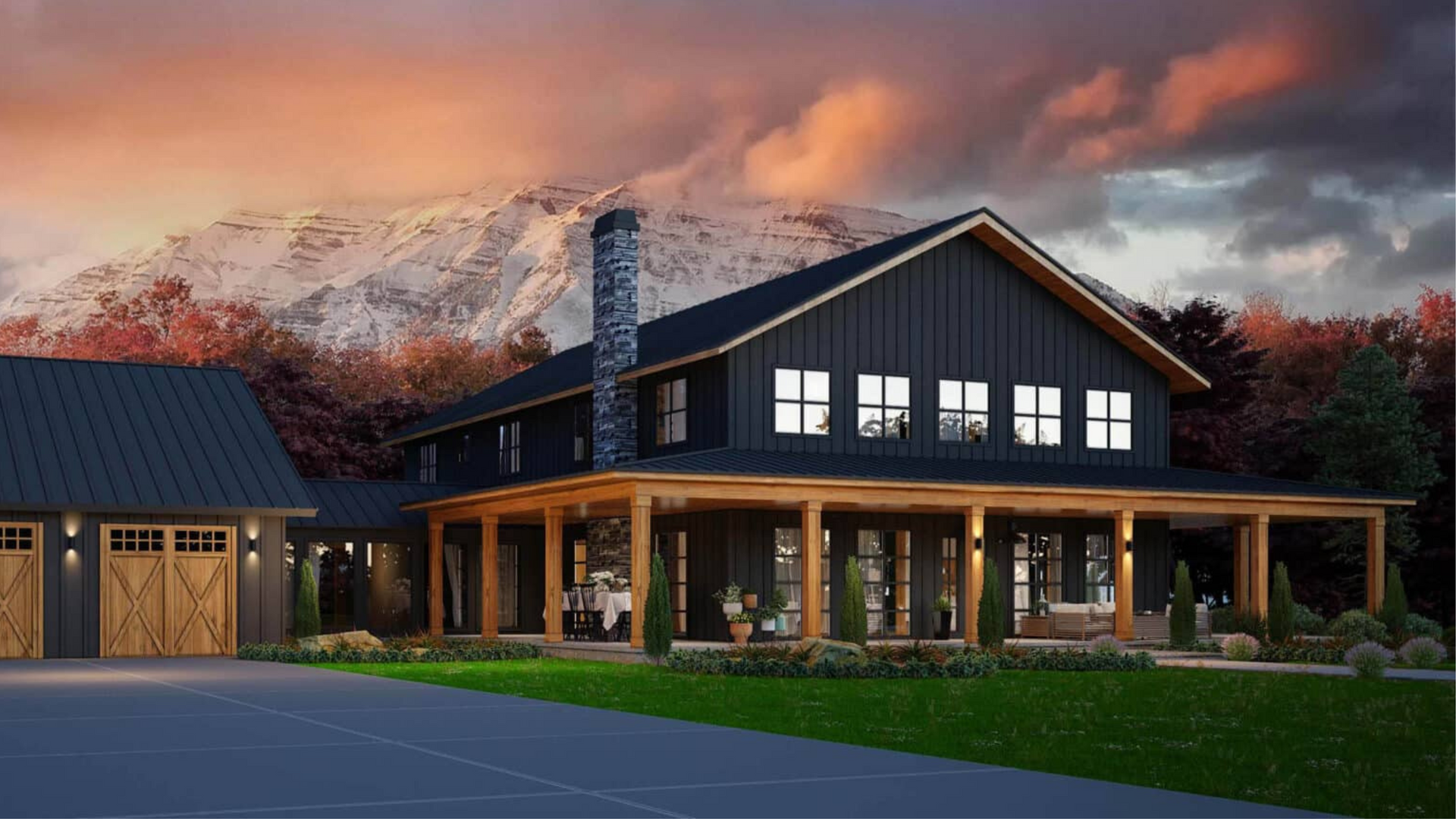 A large black house with a porch and a mountain in the background