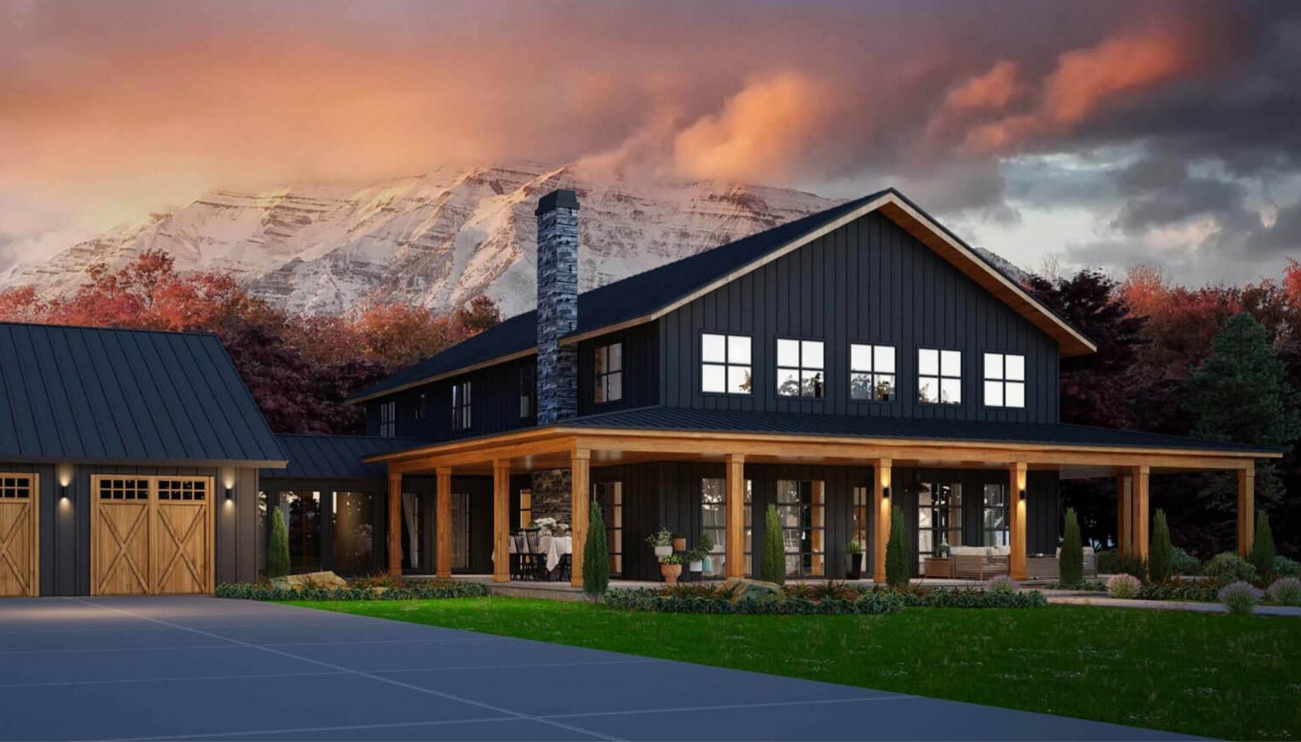 A large black house with a porch and a mountain in the background.