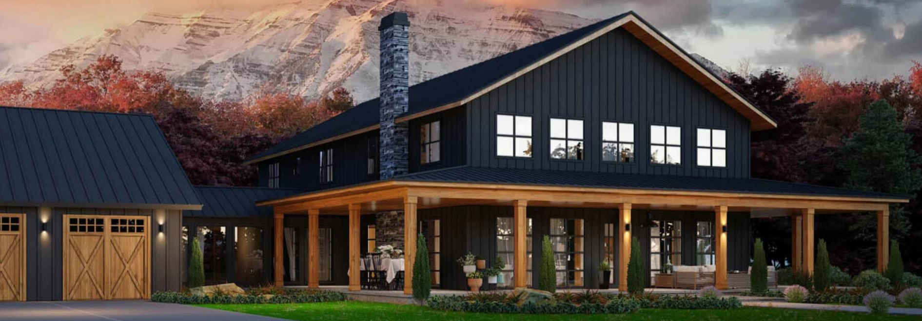 A large black house with a large porch and a garage.