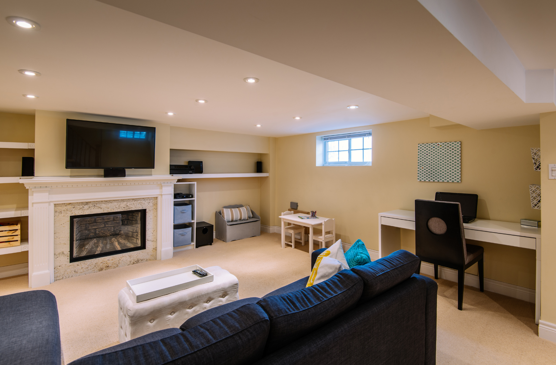 Newly remodeled basement with large flat screen TV and new couch