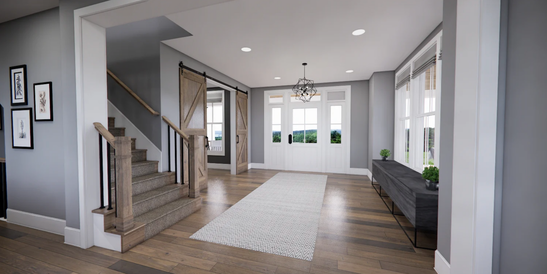 A large hallway with stairs and a couch in a house.