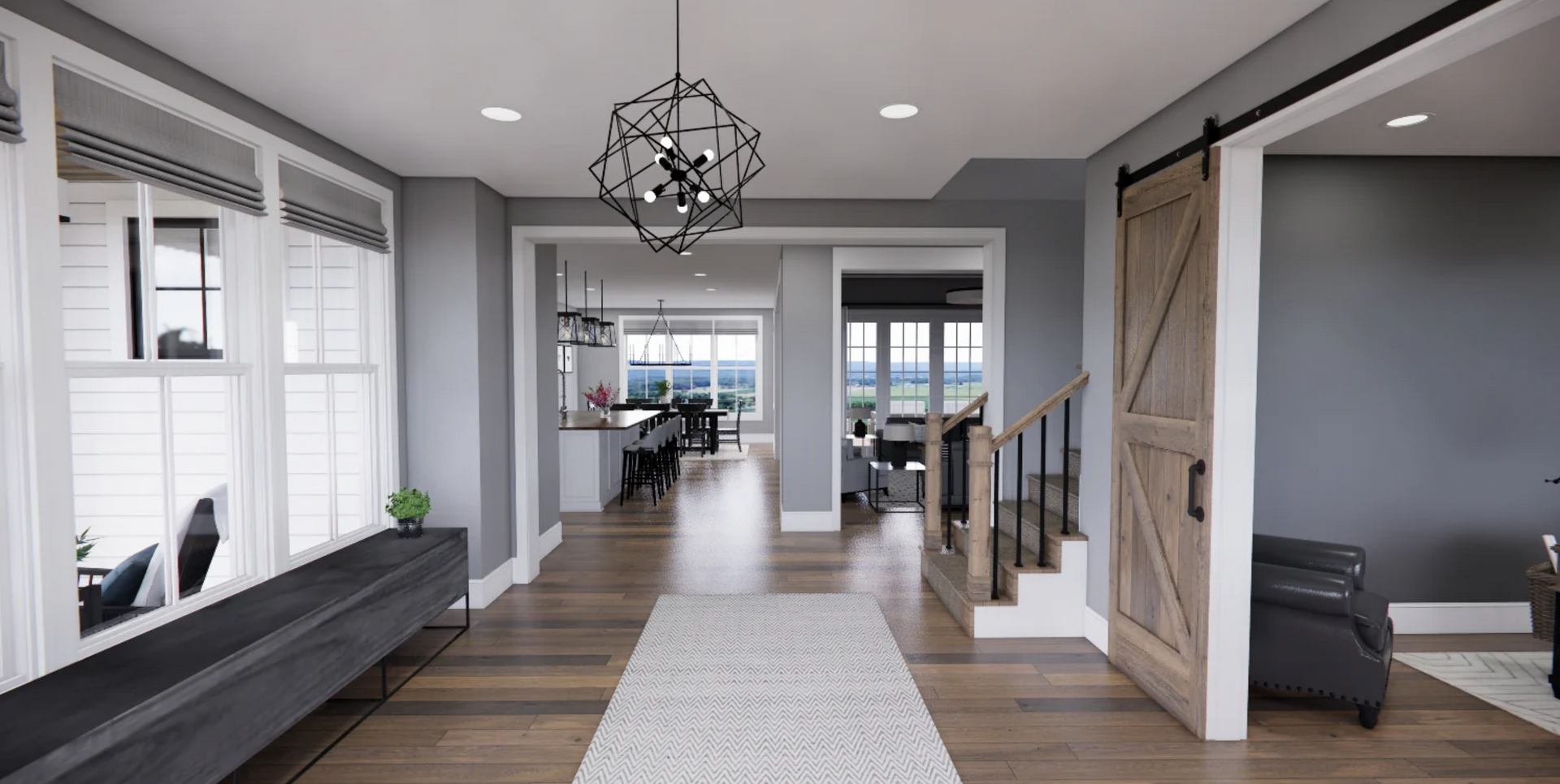 A hallway in a house with a sliding barn door and a chandelier.