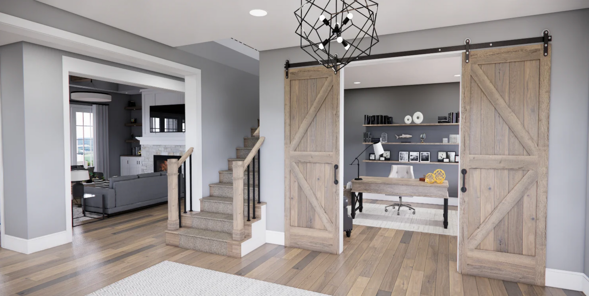 A living room with sliding barn doors leading to a home office.