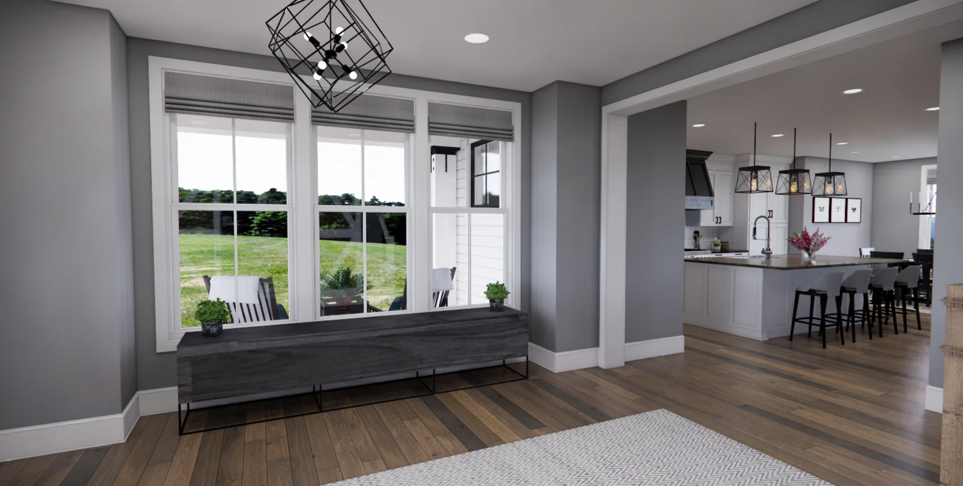 A living room with hardwood floors and a large window.