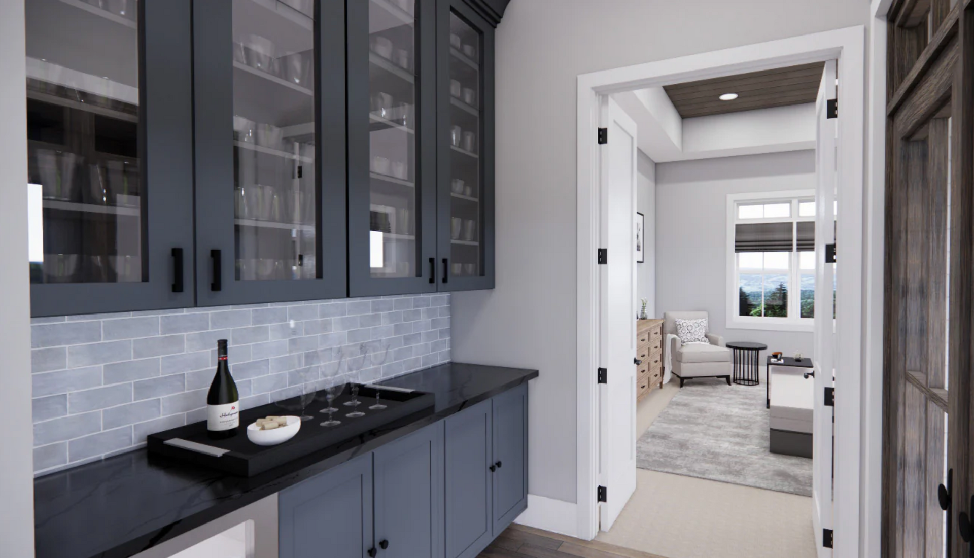 A kitchen with blue cabinets and black counter tops and a bottle of wine on the counter.