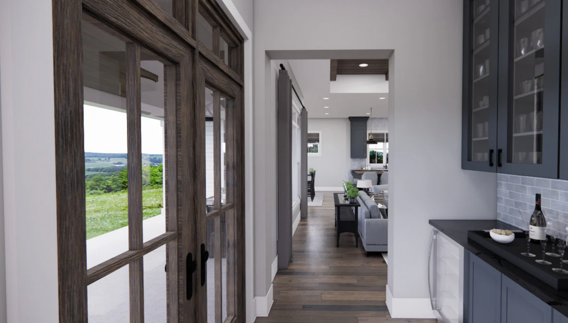 A hallway in a house with a view of a living room and a kitchen.