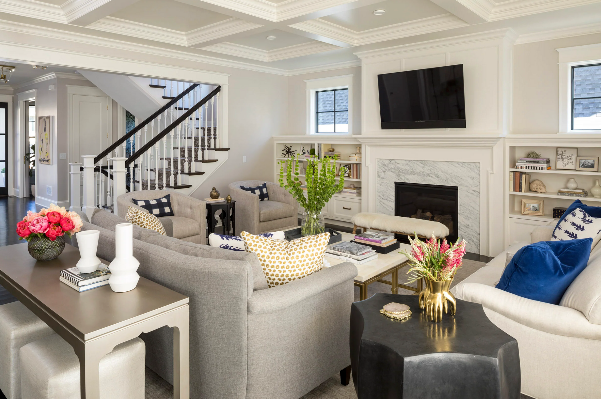 A living room filled with furniture and a fireplace.