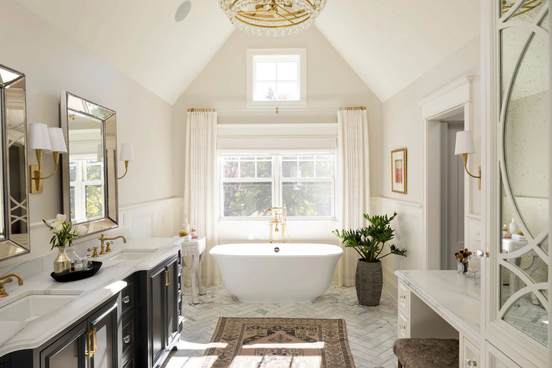 A bathroom with a bathtub , sinks , mirrors and a vaulted ceiling.