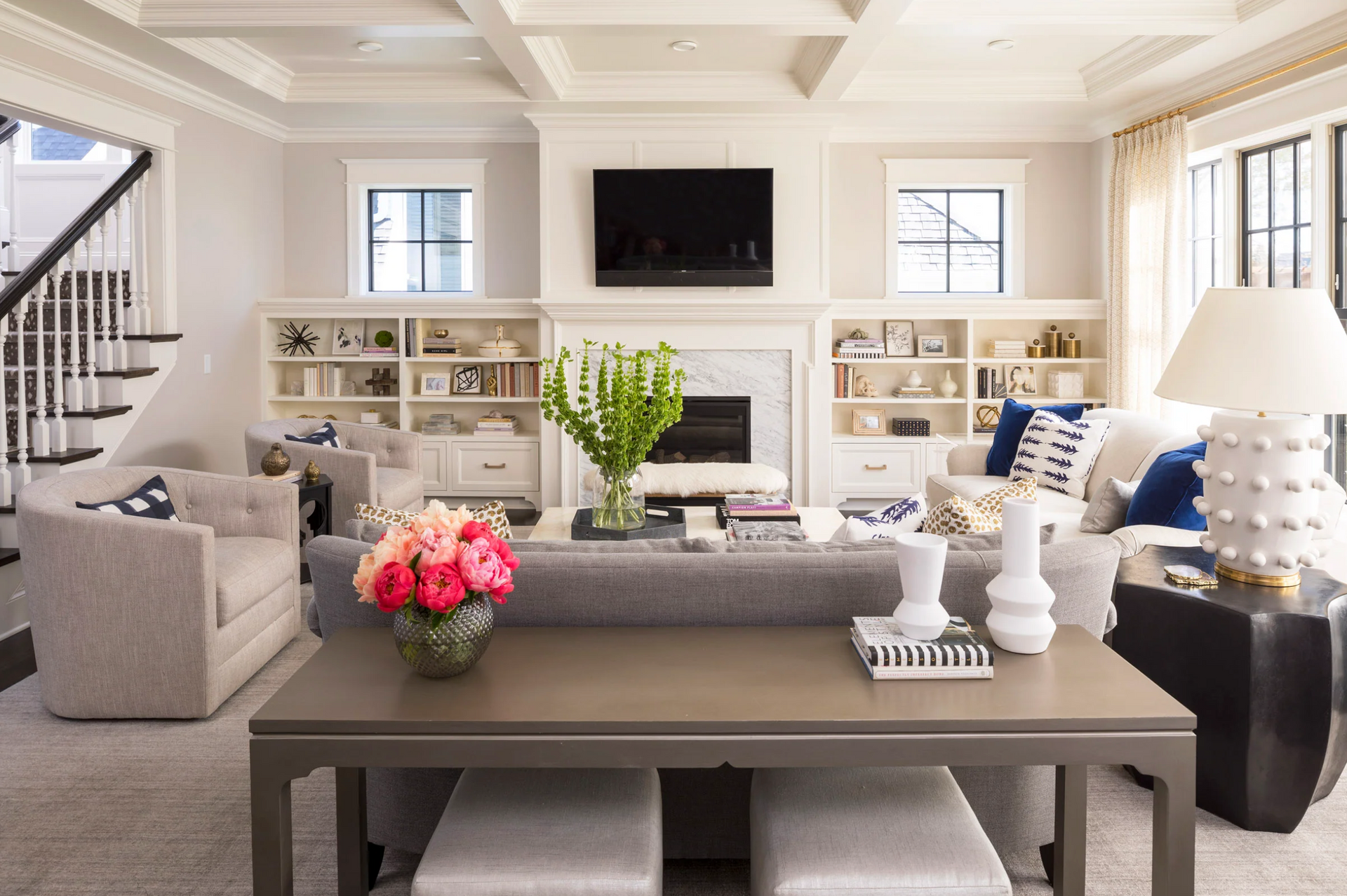 A living room filled with furniture and a fireplace.