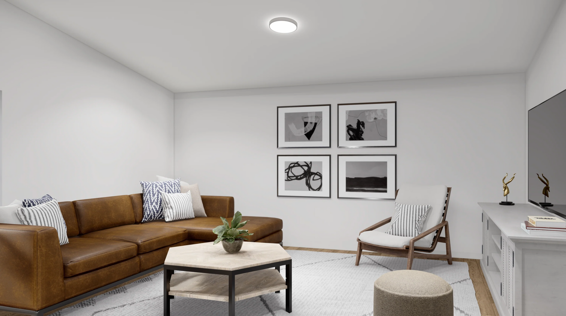 A living room with a brown couch , chair , coffee table and television.