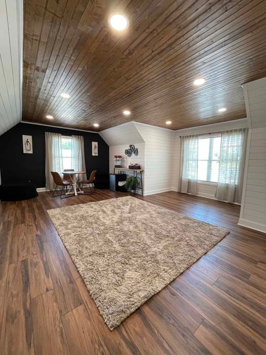 New Bonus Room with hard wood ceilings and hard wood floors and luxury lighting