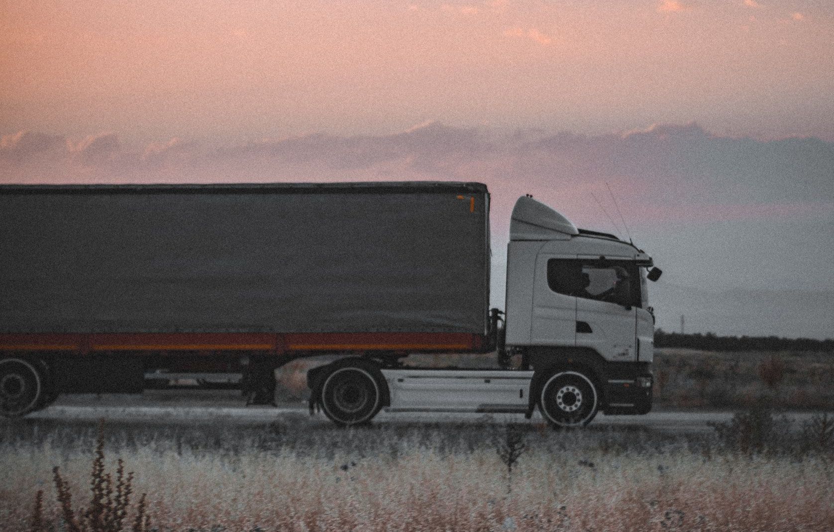 Large Freight truck delivering barndominium materials 