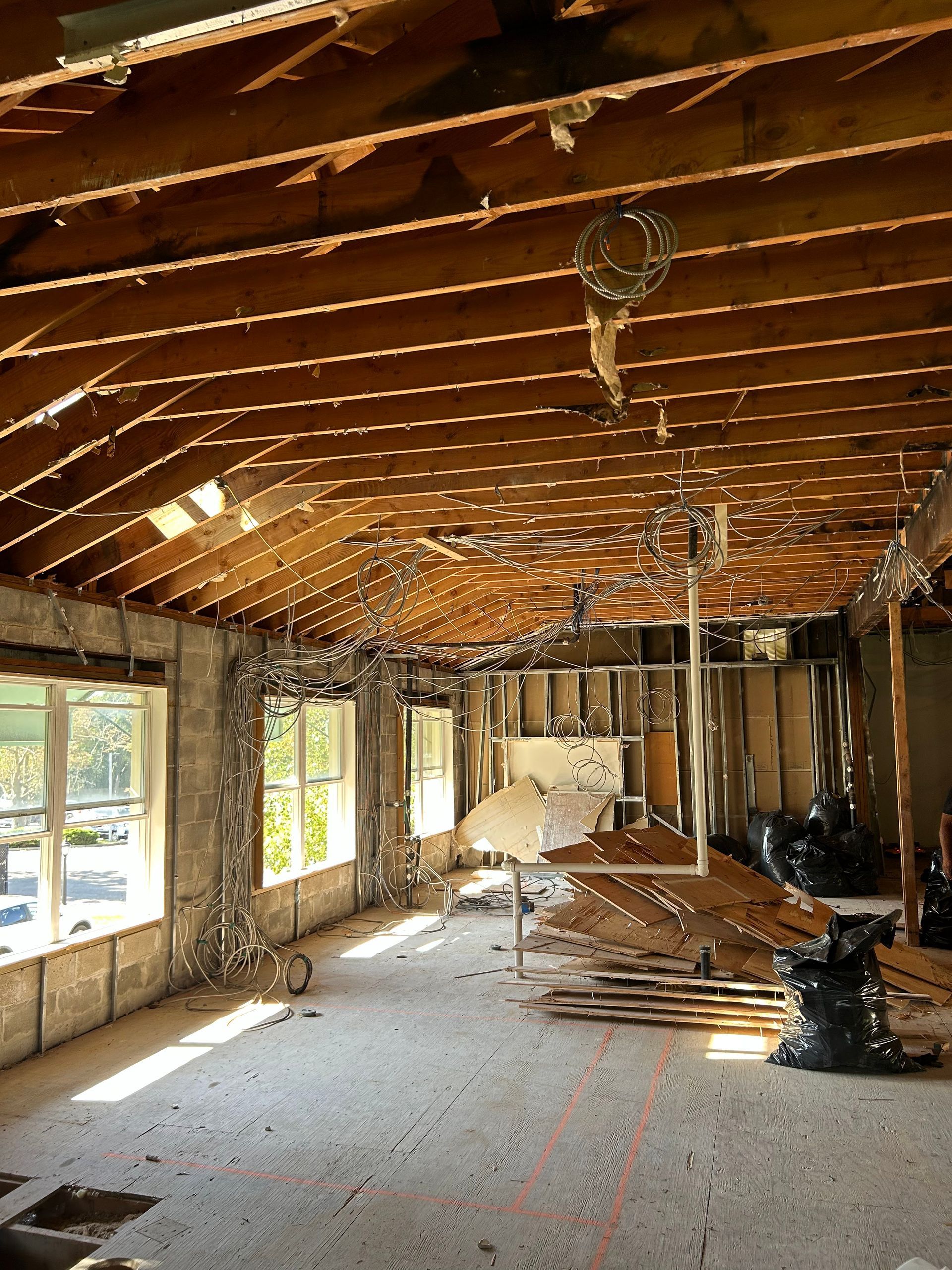 An empty room with a ceiling that is being demolished