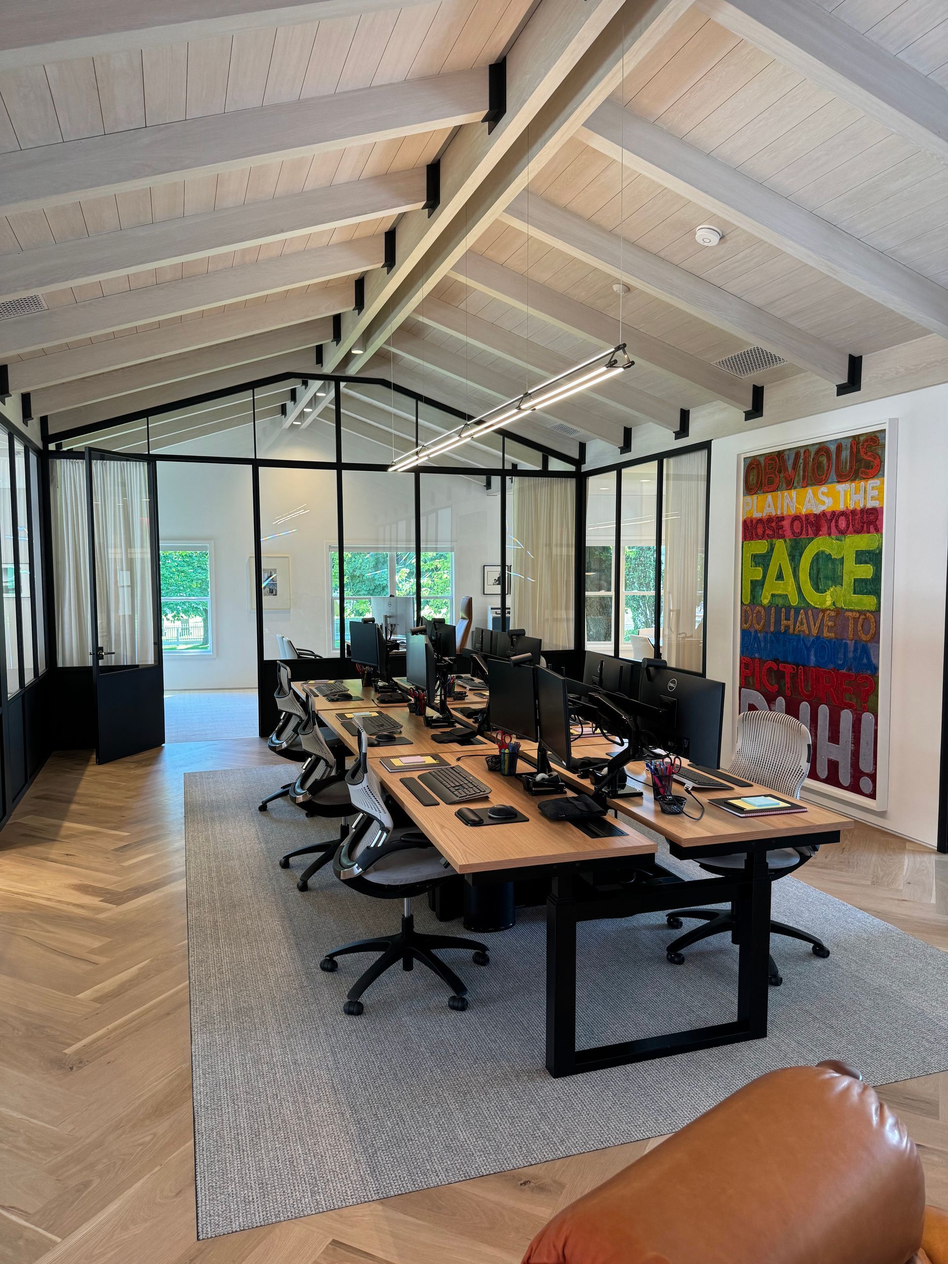 A large room with a painting on the wall that says face