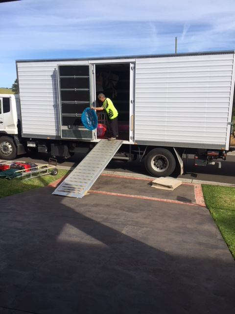 A Man Packing A Moving Truck — Fairdinkum Removals In Ulladulla, NSW