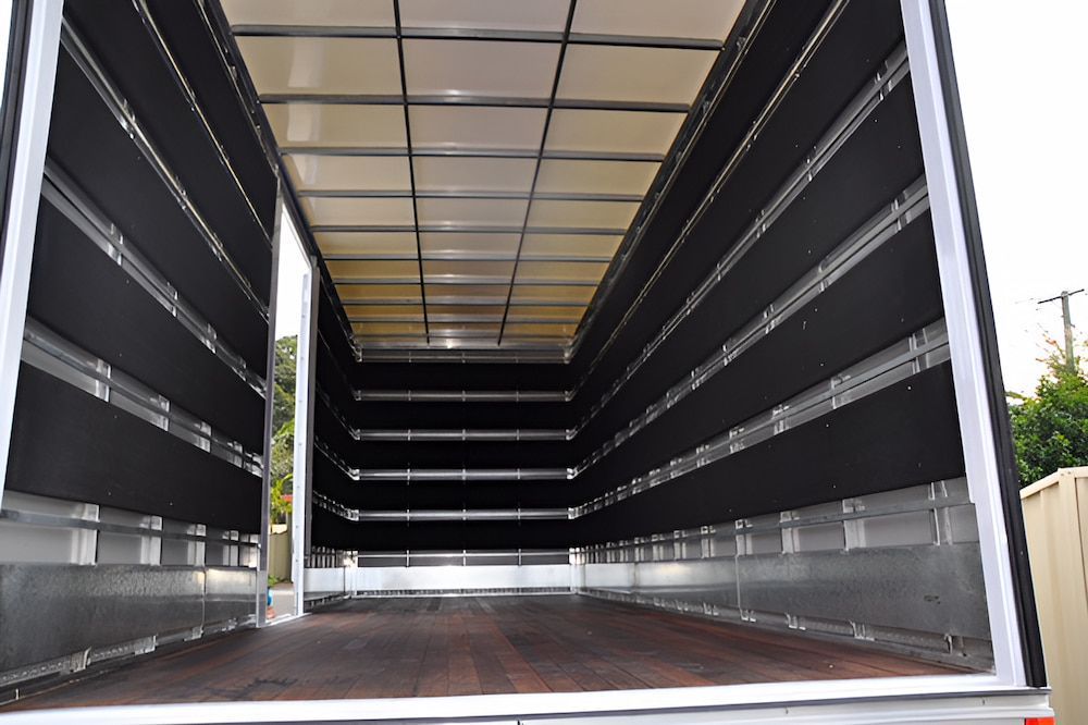 The Inside Of An Empty Truck With The Door Open — Fairdinkum Removals In Nowra, NSW