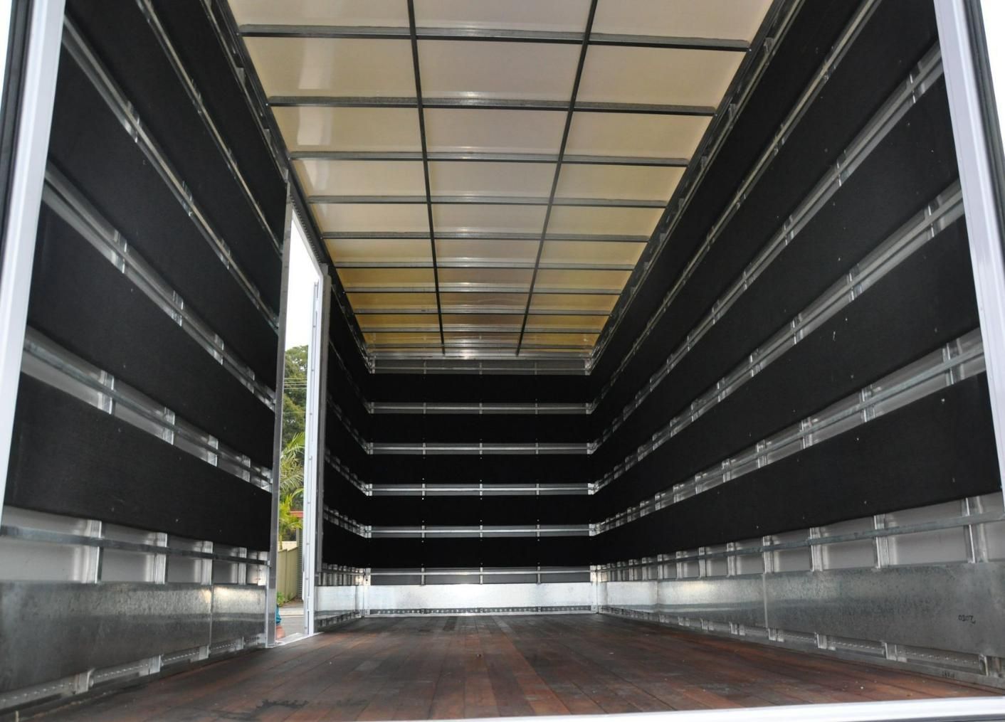 The Inside Of A Moving Truck With The Doors Open — Fairdinkum Removals In Ulladulla, NSW