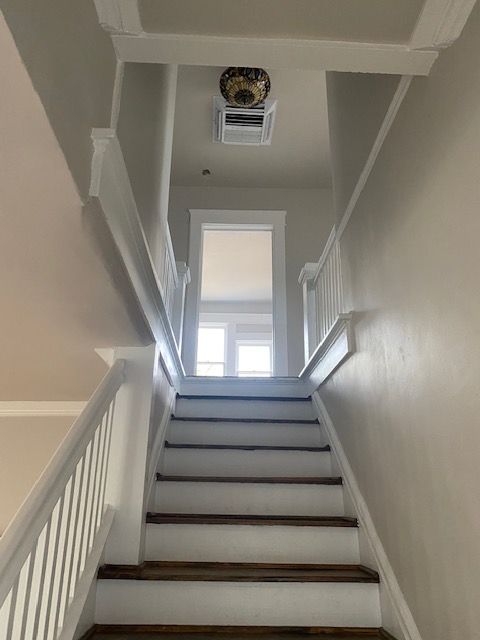 A staircase leading up to the second floor of a house.