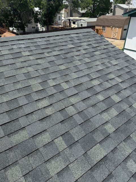 A close up of a roof with a lot of shingles on it.