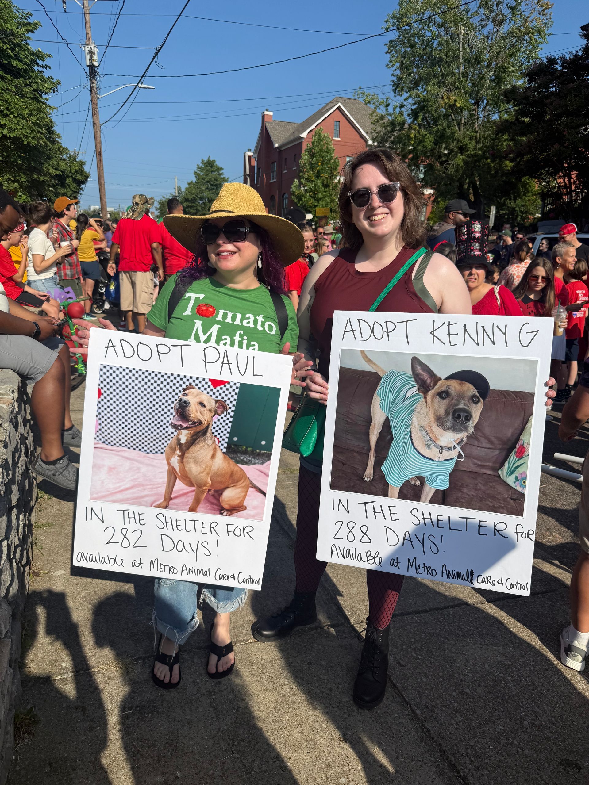 Muttz Realty team showcasing adoptable dogs in Tomato Art Fest parade with Nashville Metro Animal Care and Control