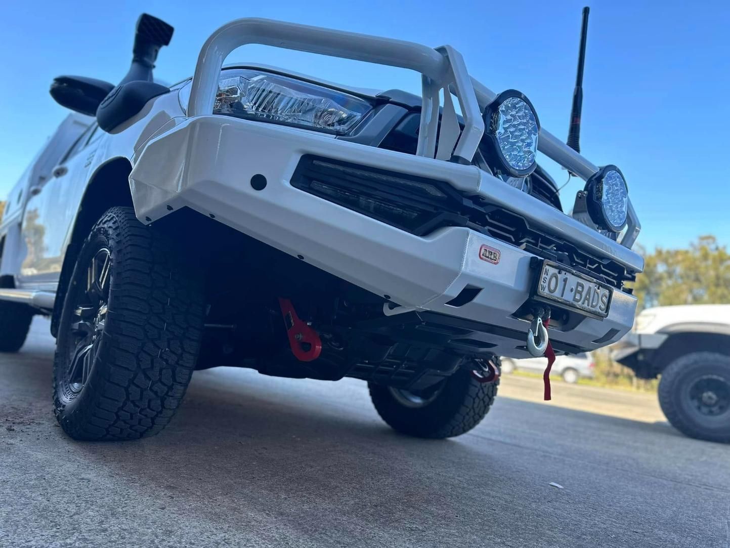 A White Truck Is Parked on The Side of The Road — Bonetig's Mobile Towbars & Trailers In Oak Flats, NSW