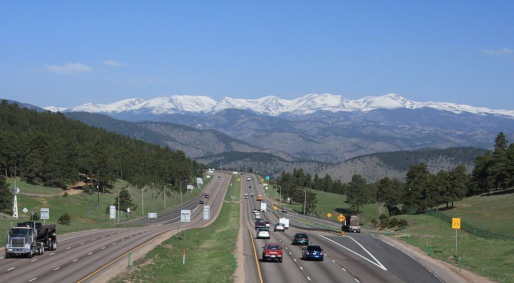 a highway with mountains in the background